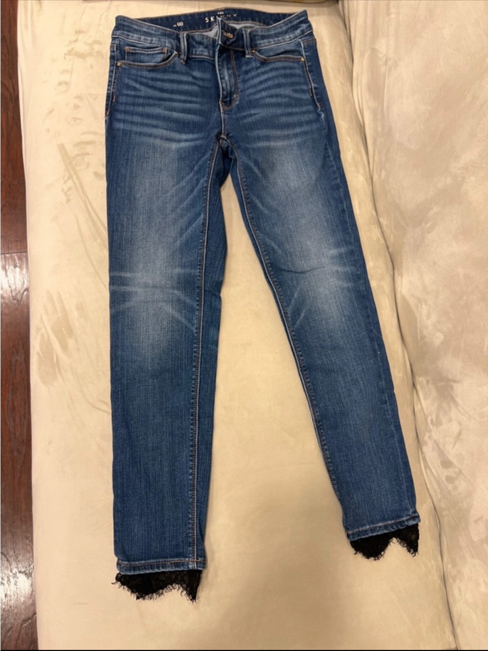 White House Black Market Blue Skinny Jeans with Raw Lace Hem